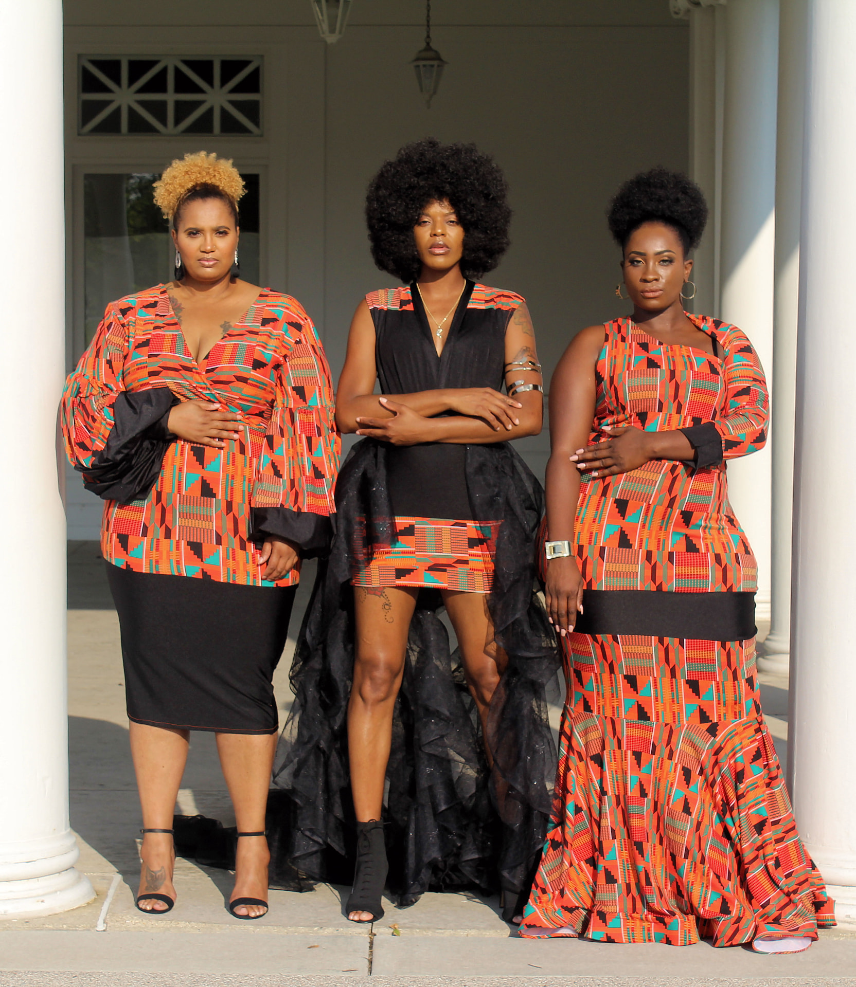Three coordinated patterned and black statement designs