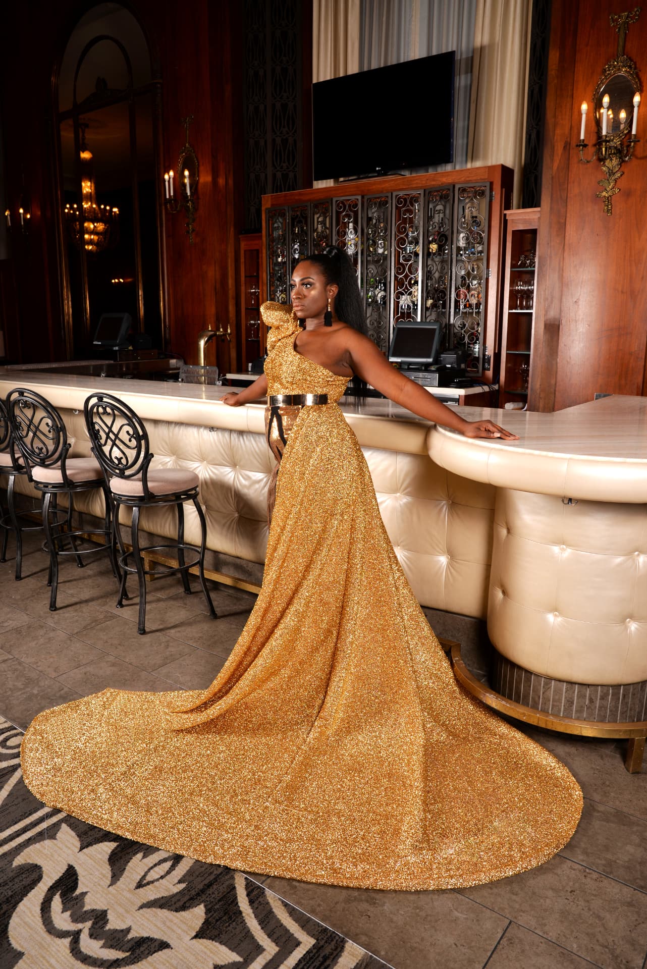 Gold glitter one-shoulder gown with sweeping train