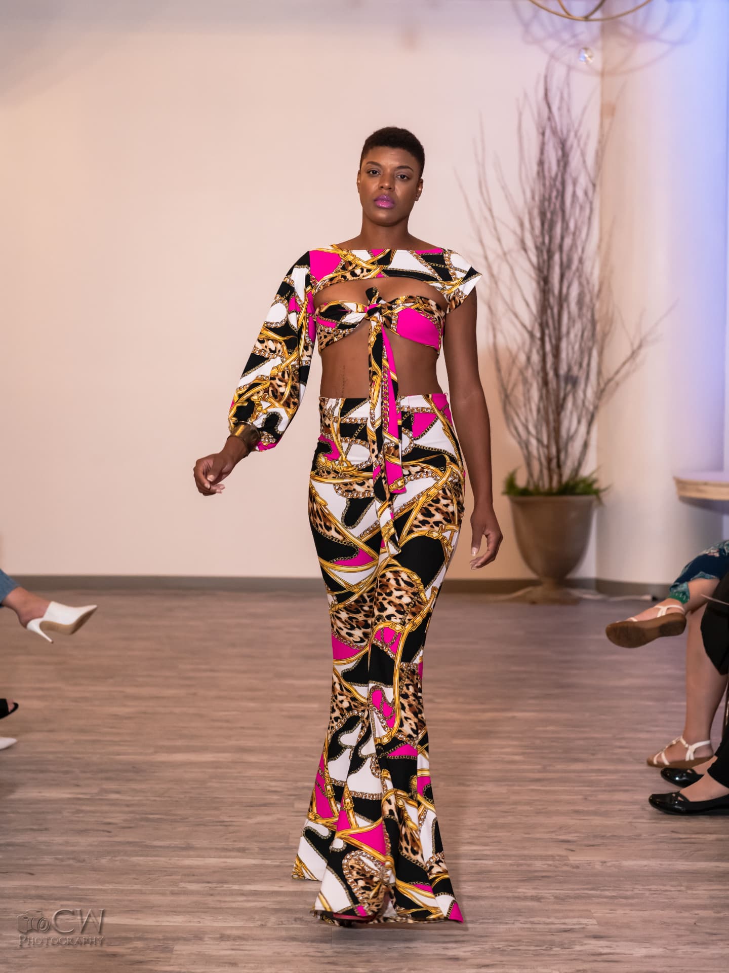 Pink, gold and leopard chain-print crop top and mermaid skirt on the runway