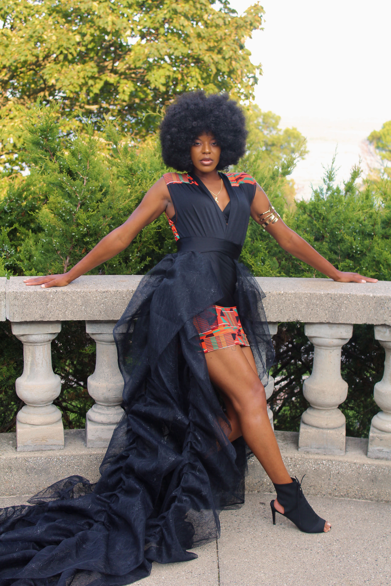 Black high-low train dress with patterned accents